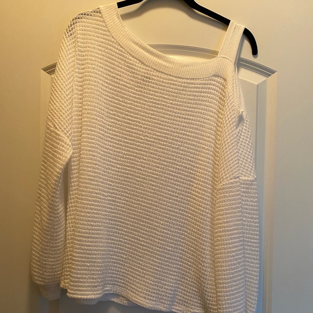 One shoulder white top.